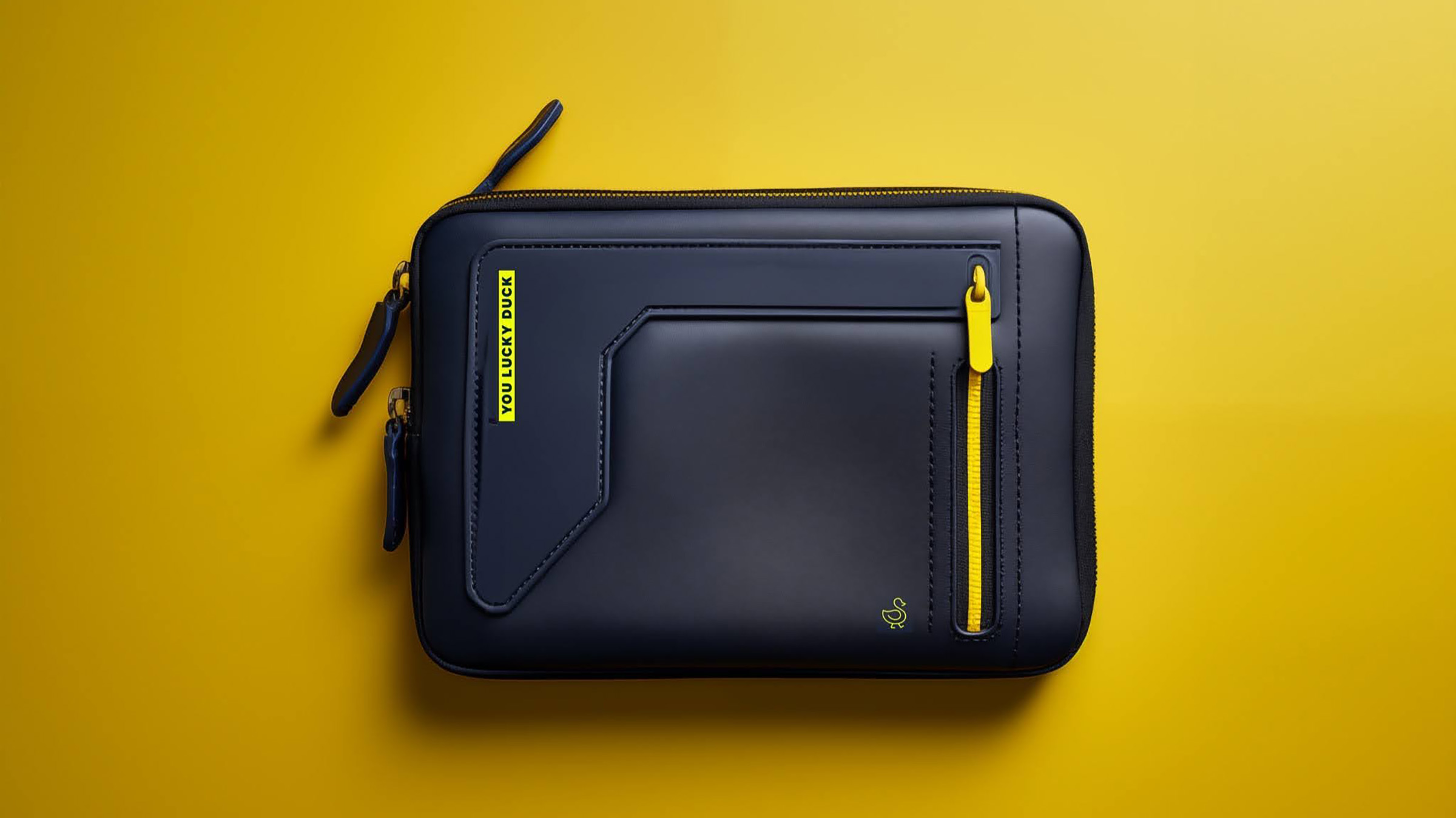 You Lucky Duck kit — navy zippered travel pouch on yellow